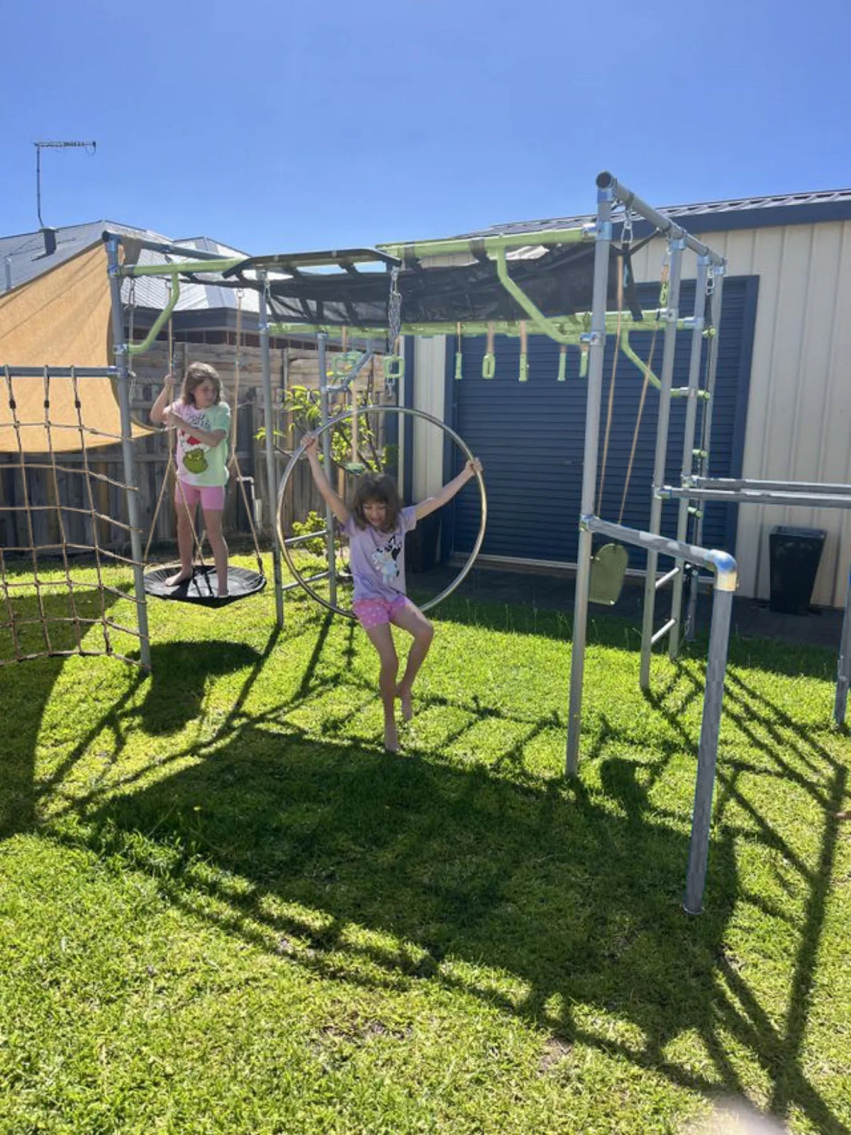 Aerial Hoop in use on a Growplay frame in a family garden