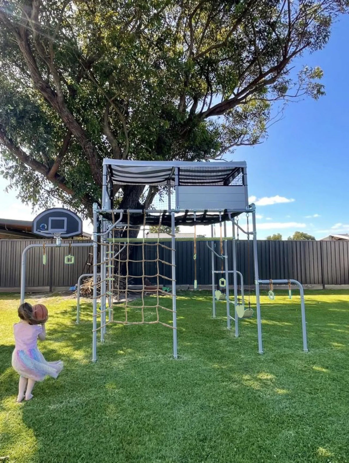 Basketball Set in use on a Growplay frame in a family garden