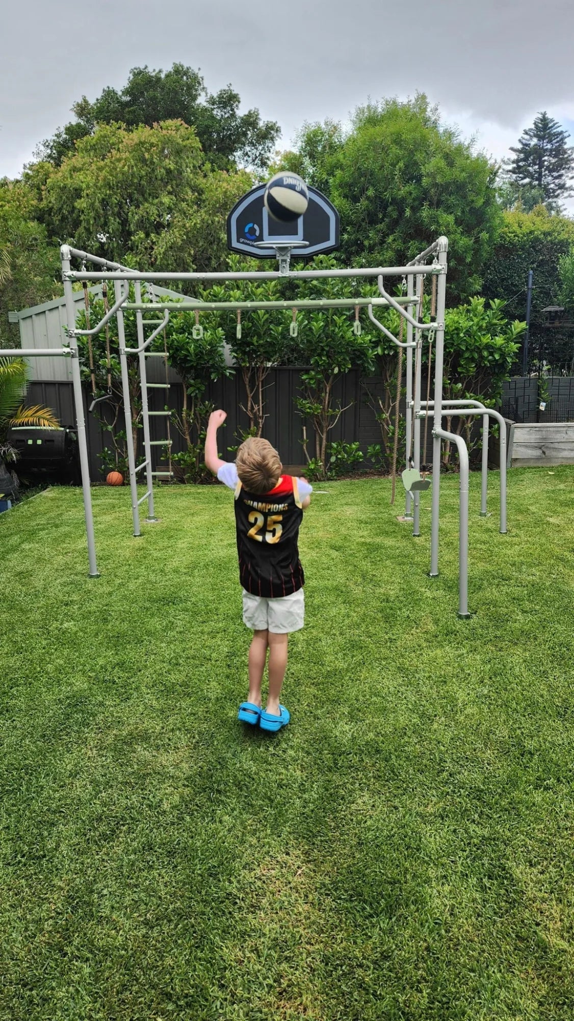 Basketball Set in use on a Growplay frame in a family garden
