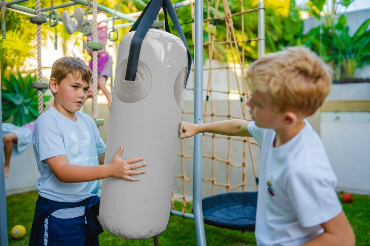 Boxing Bag in use on a Growplay frame in a family garden