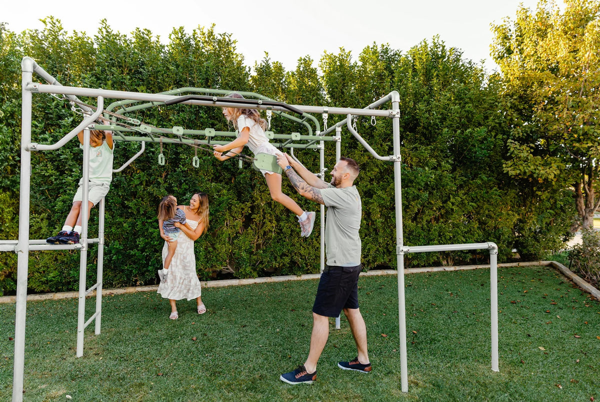 Classic Swing in use on a Growplay frame in a family garden