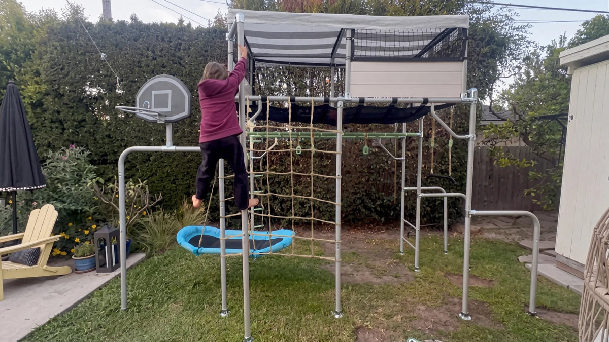 Fireman Pole in use on a Growplay frame in a family garden
