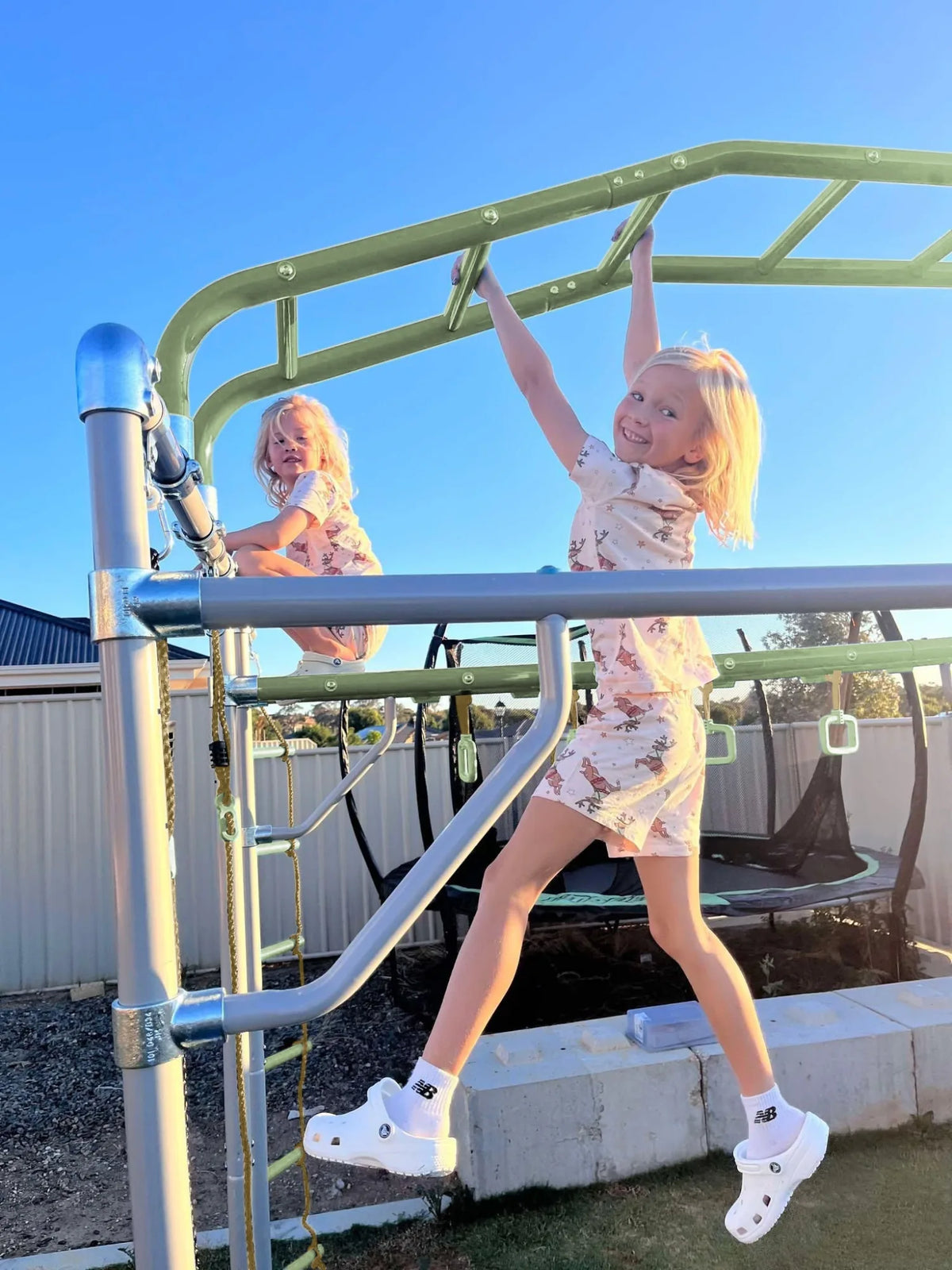Monkey Bridge in use on a Growplay frame in a family garden