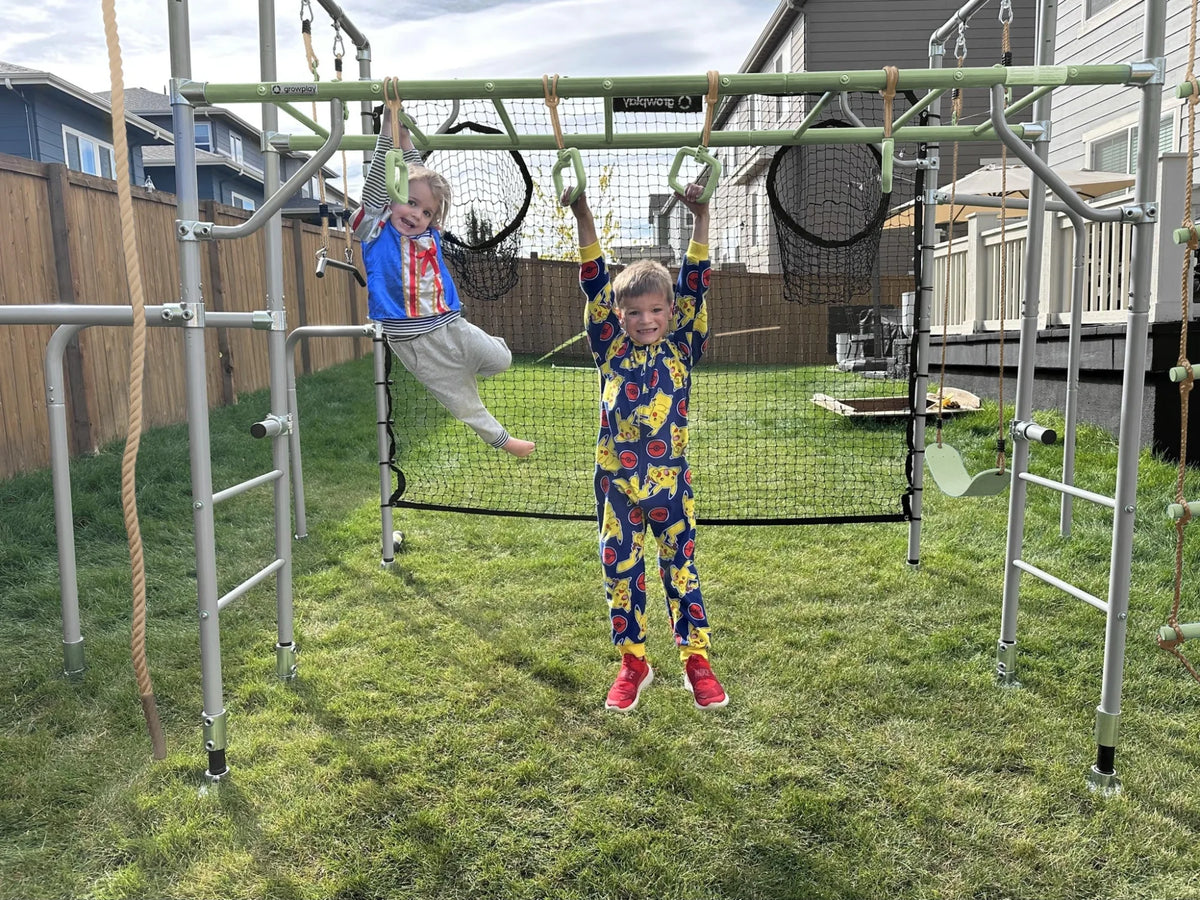 Monkey Rings in use on a Growplay frame in a family garden