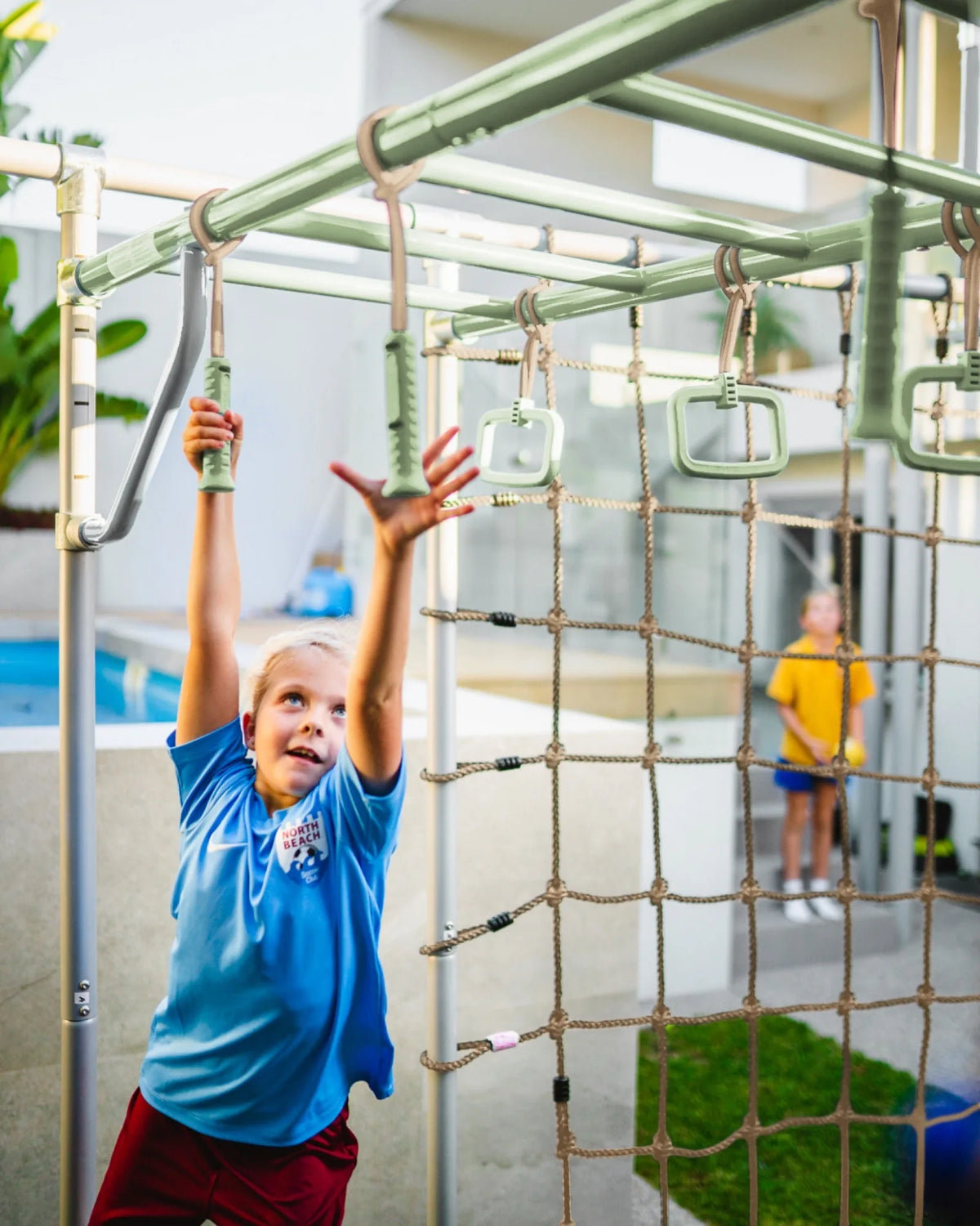 Ninja Sticks in use on a Growplay frame in a family garden