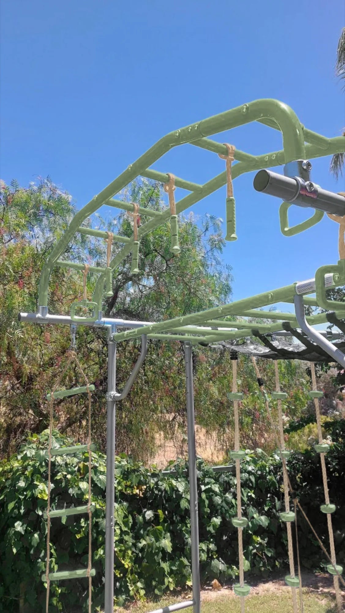 Ninja Sticks in use on a Growplay frame in a family garden
