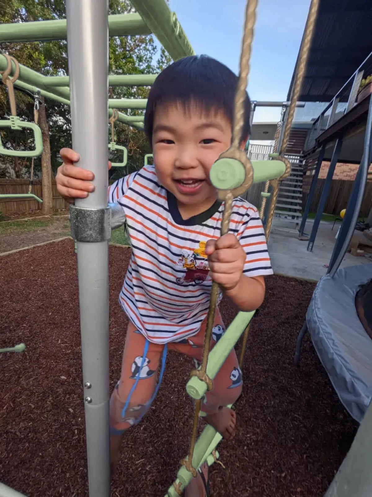 Rope Ladder in use on a Growplay frame in a family garden