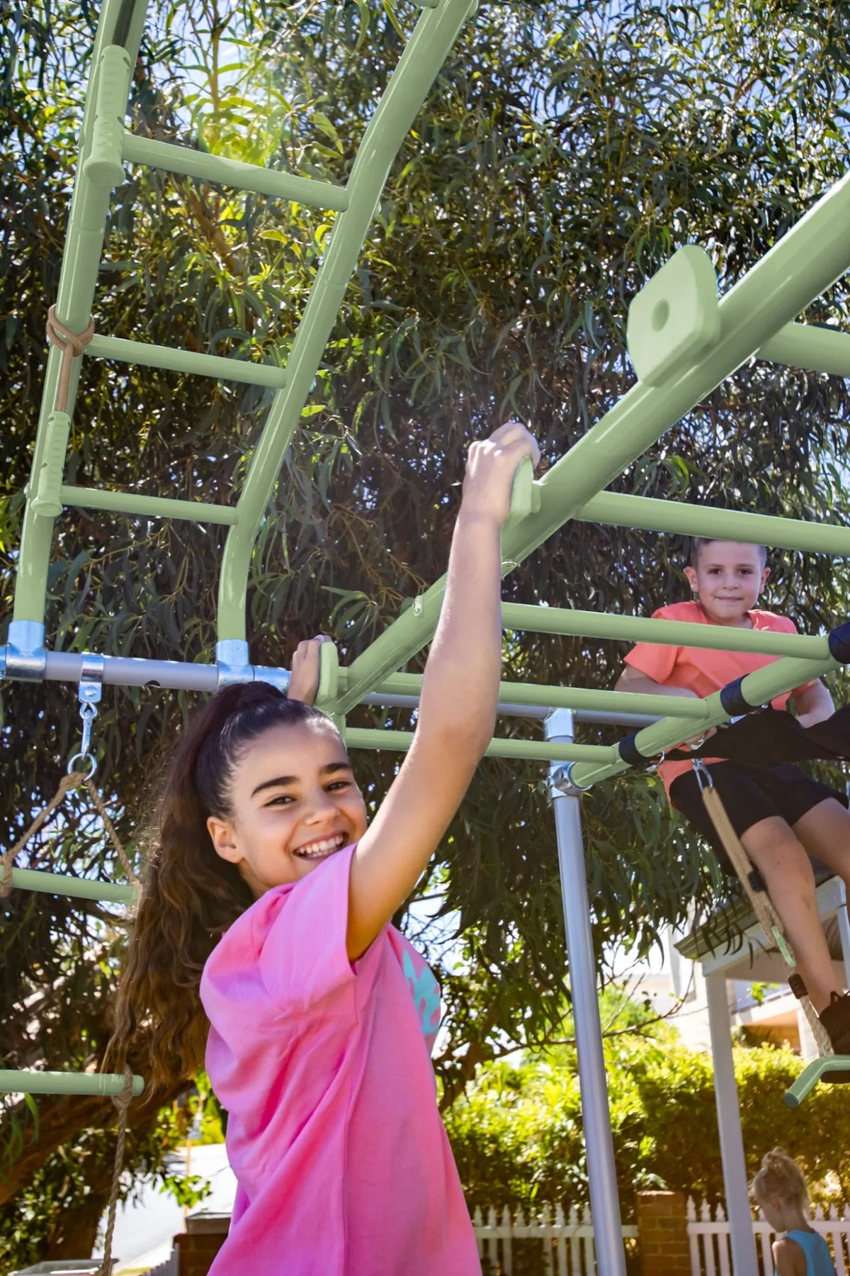 Rock Grips in use on a Growplay frame in a family garden