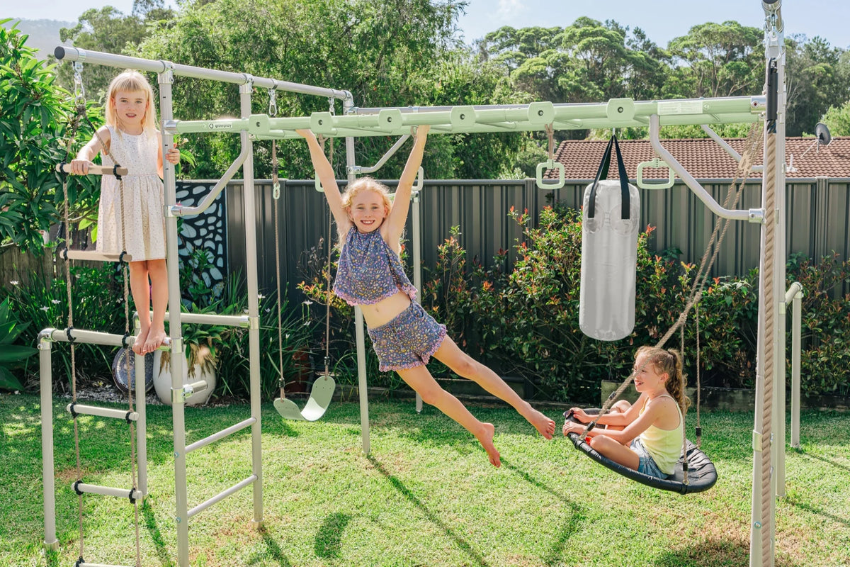 Rock Grips in use on a Growplay frame in a family garden