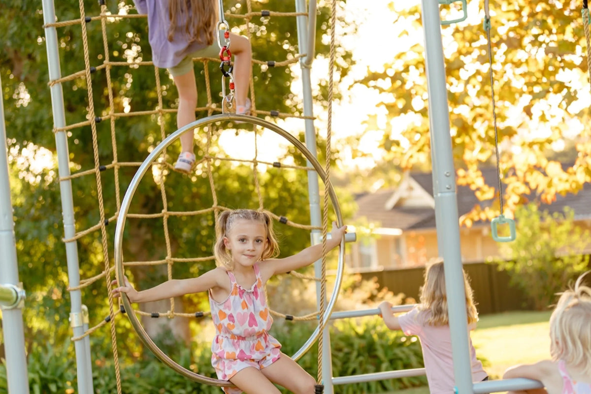 Aerial Hoop in use on a Growplay frame in a family garden