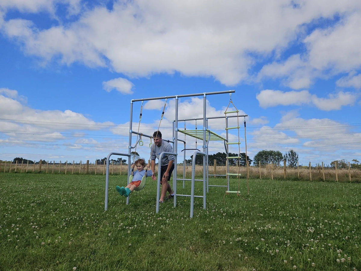 Classic Swing in use on a Growplay frame in a family garden