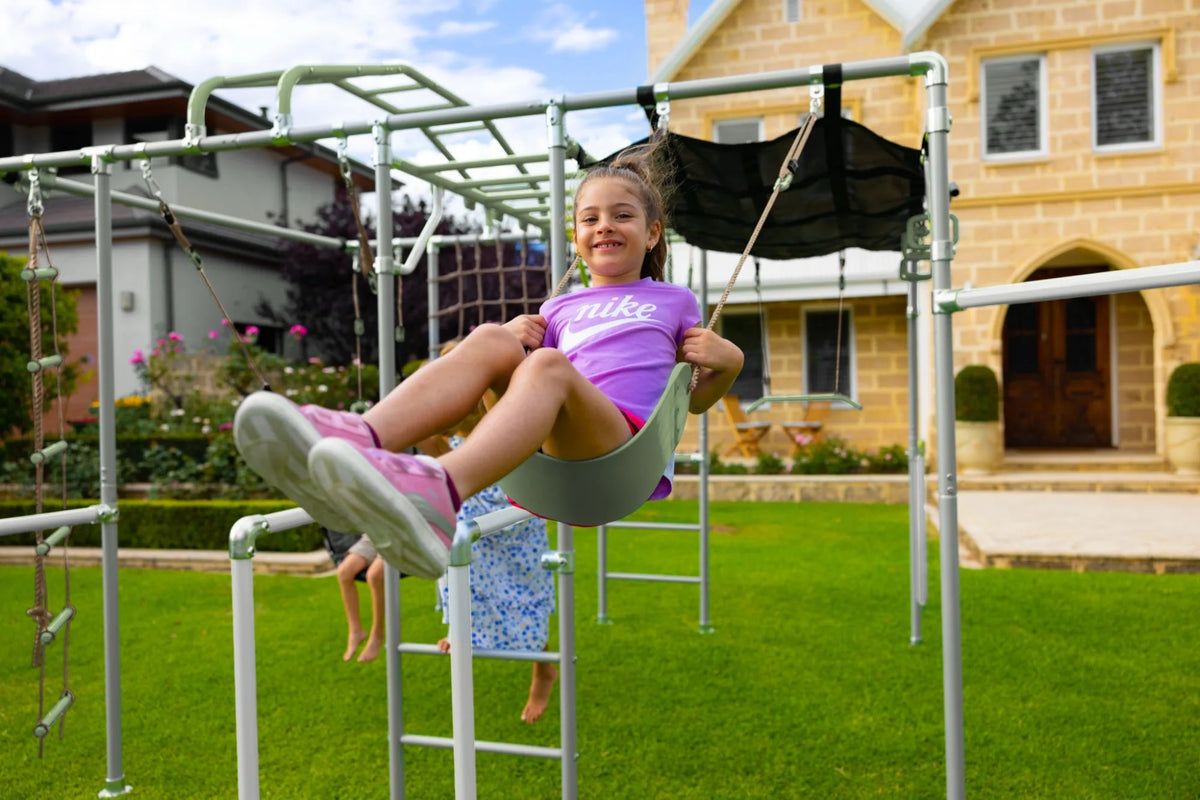 Classic Swing in use on a Growplay frame in a family garden