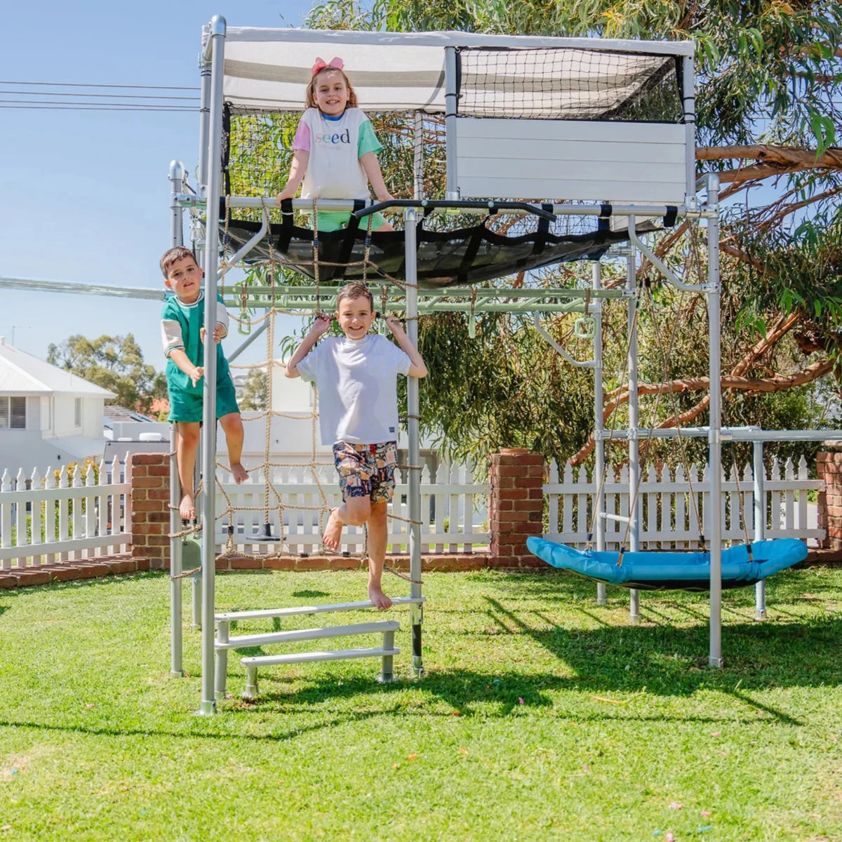 Playhouse in use on a Growplay frame in a family garden