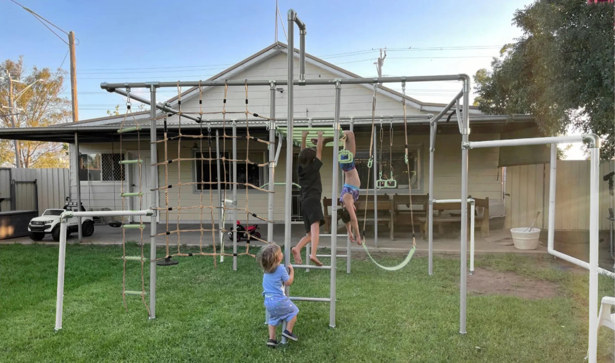 Fireman Pole in use on a Growplay frame in a family garden