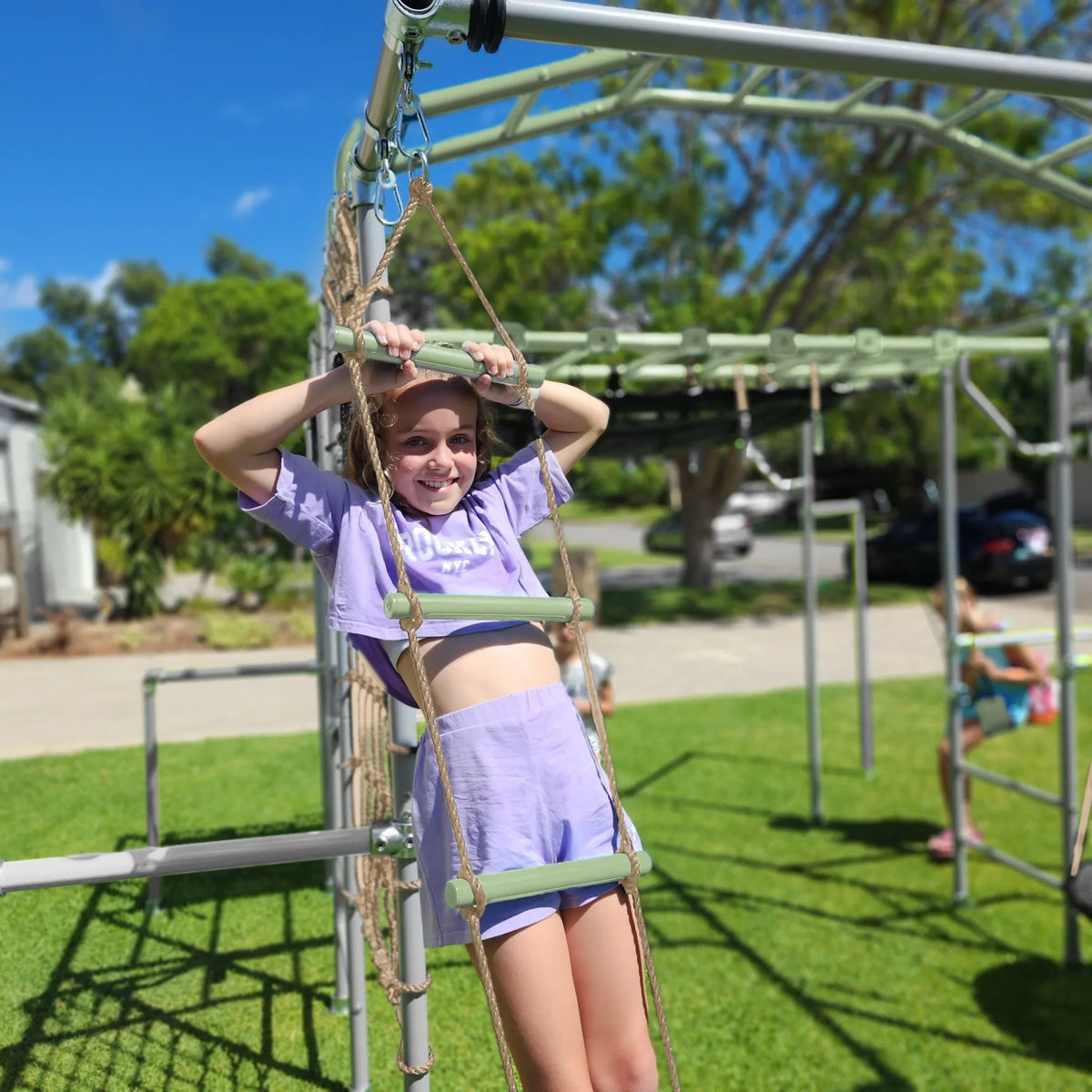 Rope Ladder in use on a Growplay frame in a family garden
