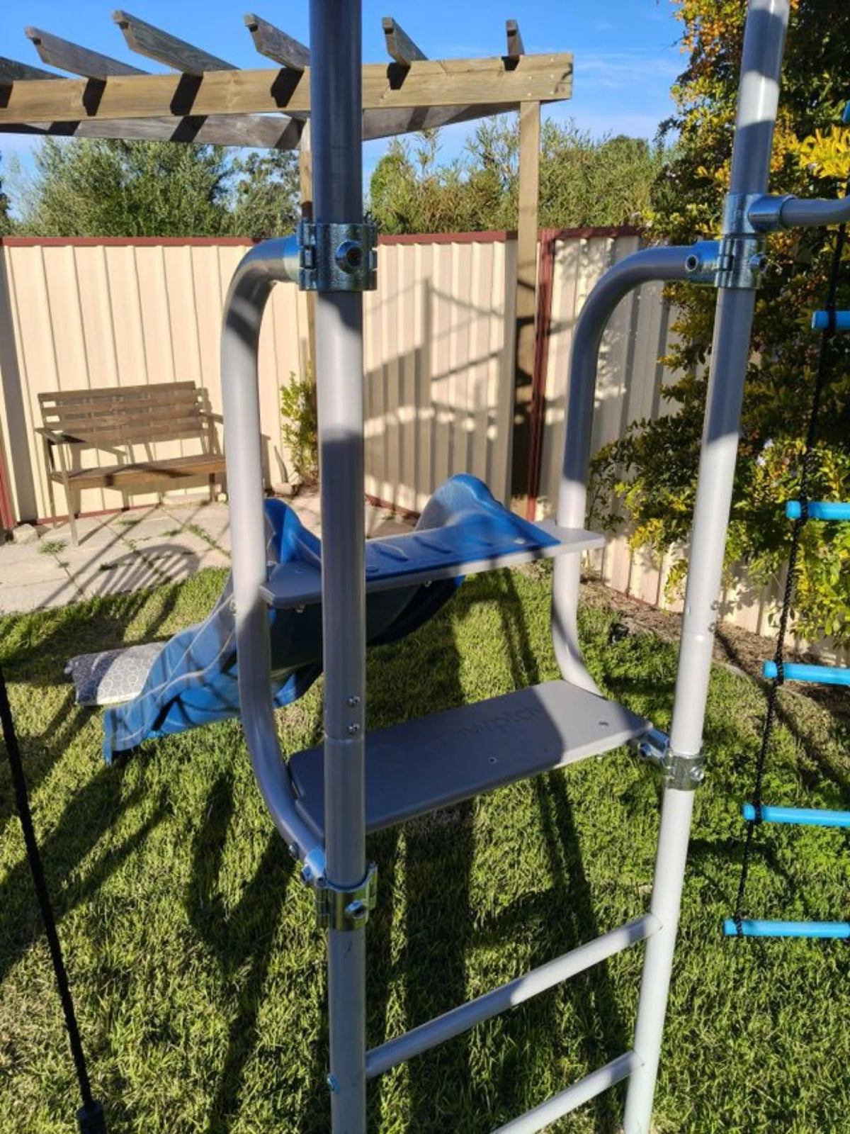 Slide Mount in use on a Growplay frame in a family garden