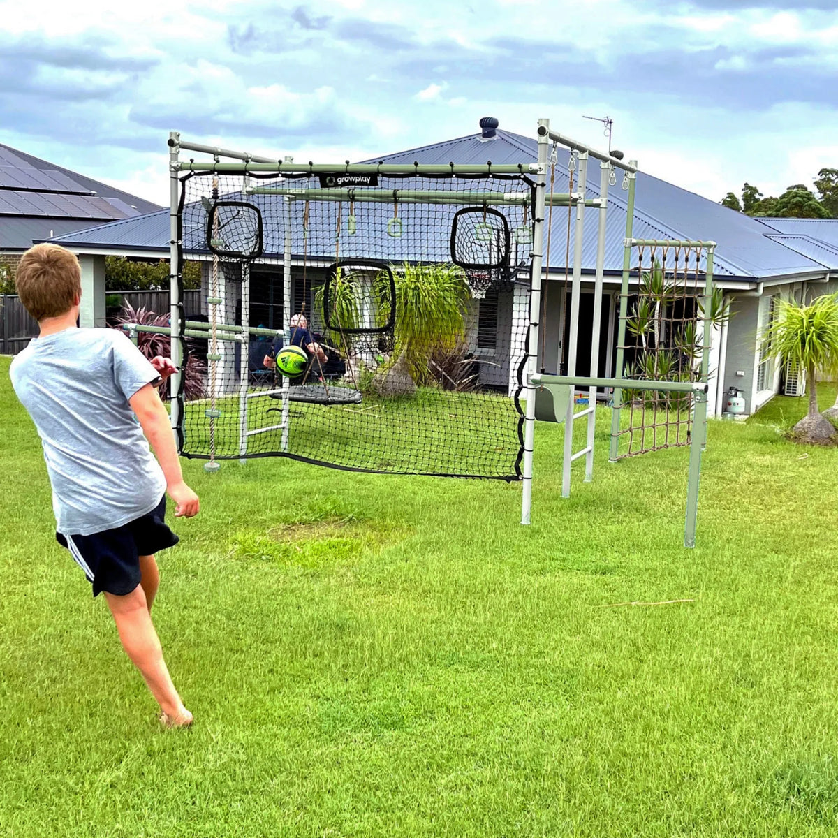 Football Net in use on a Growplay frame in a family garden