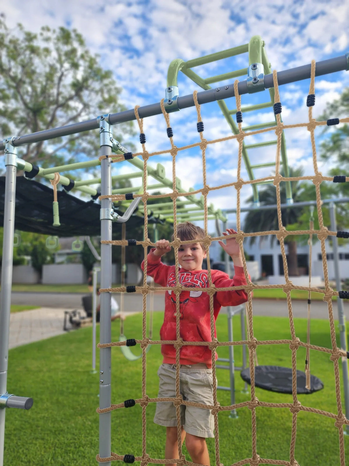 Cargo Net + Pole in use on a Growplay frame in a family garden