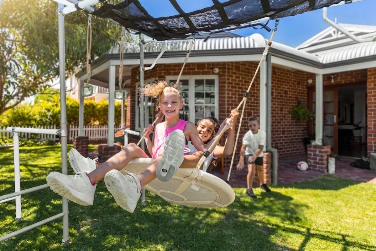 Net Swing in use on a Growplay frame in a family garden