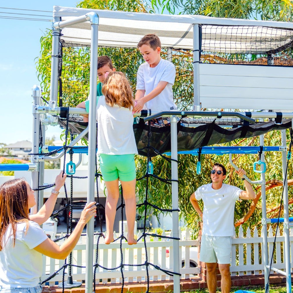Children playing in a garden playhouse UK